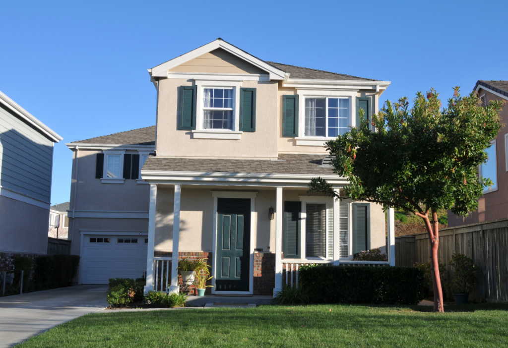 a house with a lawn and a fence. moldfix mold remediation success stories